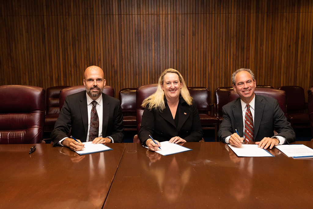 Principal Deputy Assistant Secretary Loren Sweatt, USDOL-OSHA (center), NWRA President and CEO Darrell Smith (left) and SWANA Executive Director and CEO David Biderman (right) at the Alliance signing ceremony on September 27, 2019.