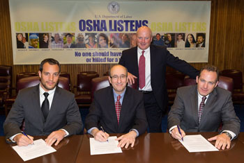 (L to R) Doug DeSilvio, Worker Representative, SWR Institute; then-Assistant Secretary Dr. David Michaels, USDOL-OSHA; Jim Dougherty, Safety Committee Member, SWR Institute; and Dave Grady President, SWR Institute sign a national Alliance renewal agreement on March 20, 2014.