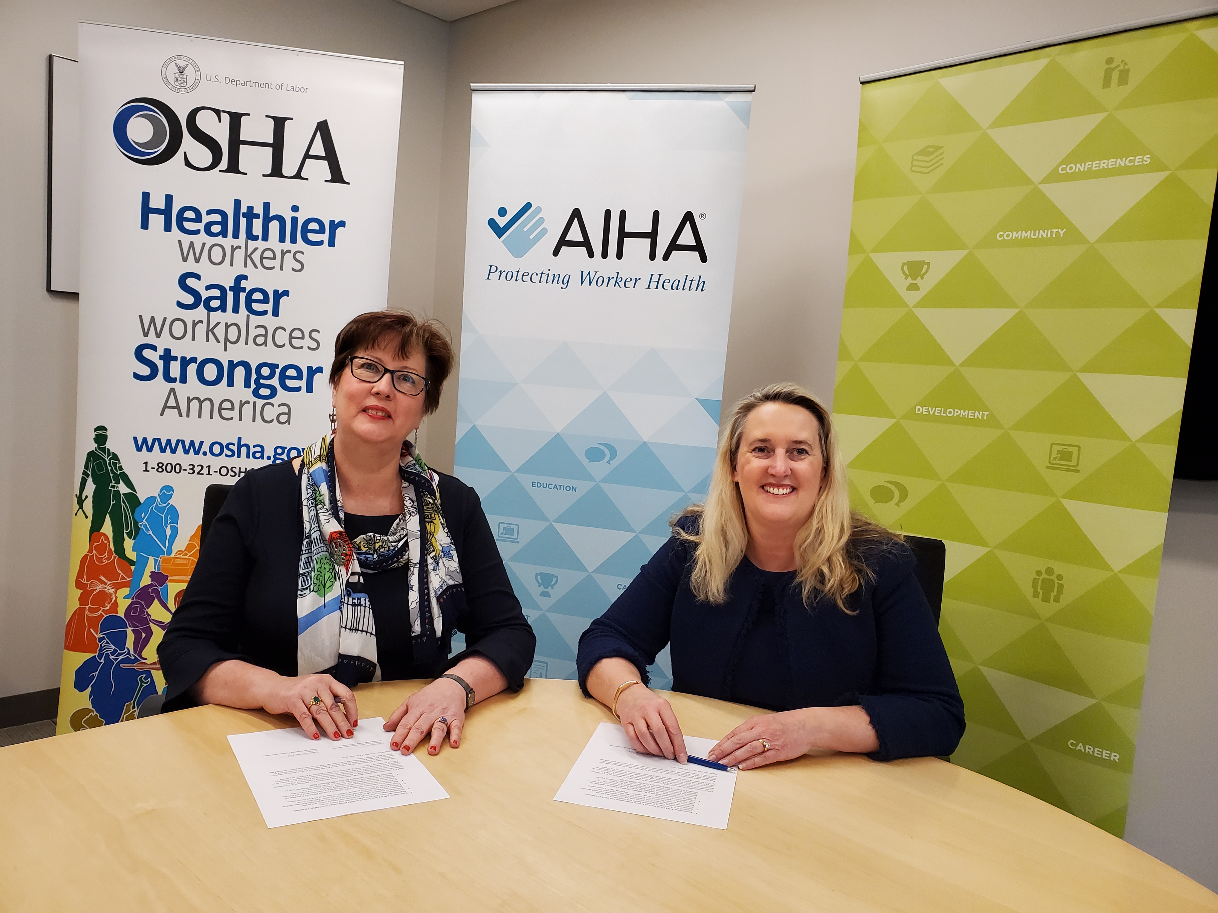 AIHA President, Kathleen Murphy (left) and Principal Deputy Assistant Secretary Loren Sweatt, USDOL-OSHA (right) signing the Ambassador document on February 21, 2020.