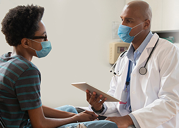 Doctor speaking with patient