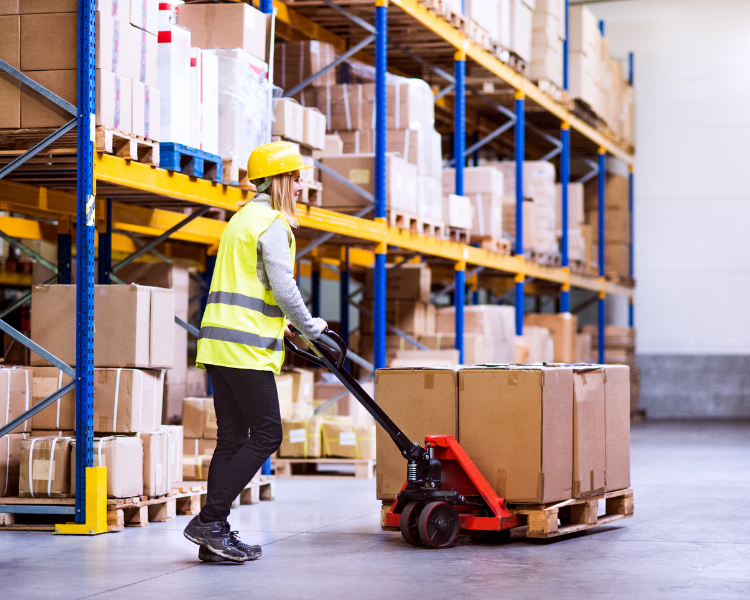 holiday and small business – woman in warehouse