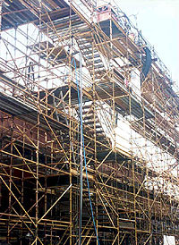 Image of independent metal pole scaffolding on the side of a ship