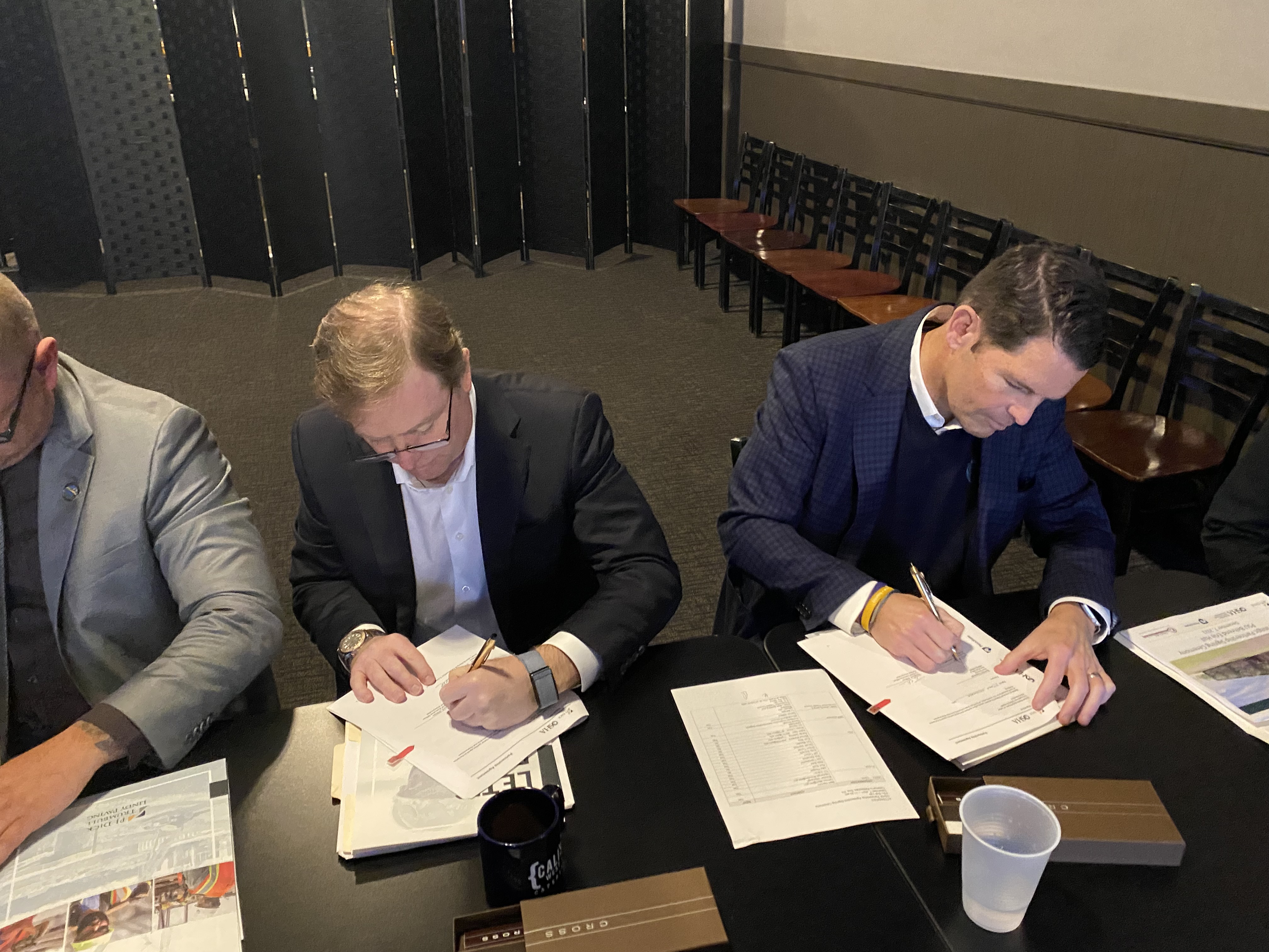 Timothy B. O’Brien, Co-Chief Executive Officer, P.J. Dick Incorporated and Jake D. Ploeger, Co-Chief Executive Officer, P.J. Dick Incorporated sign the Partnership agreement.