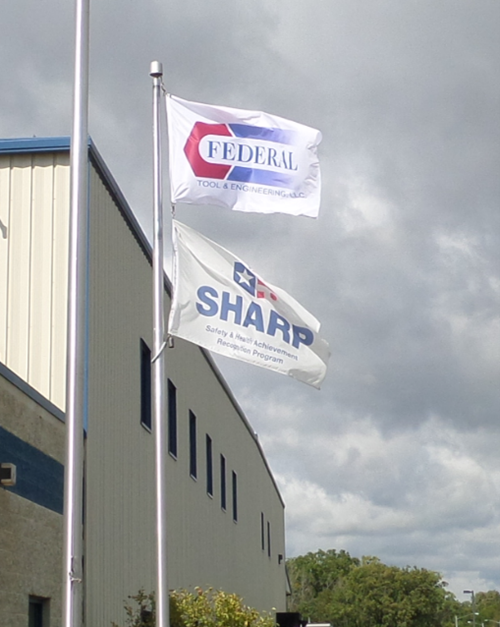 Federal Tool & Engineering LLC (FTE) prominently flies the SHARP flag outside its facility in West Bend, WI.