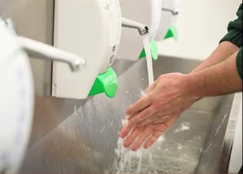 Worker demonstrating proper hand-washing