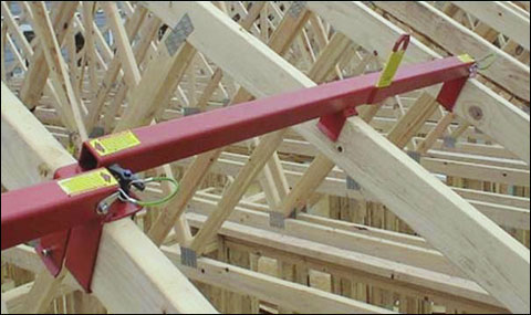 Figure 4 - An example of a spreader attached to roof trusses. For problems with accessibility in using figures and illustrations, please contact the DOC at 202-693-2020.