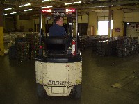 Figure 1. Forklift transporting materials