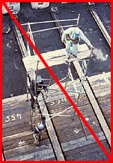 Figure 24: Improper practice - Workers exposed to falls from ladder and scaffold
