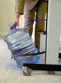 Fig. 10: close-up of bottle being tilted onto cradle