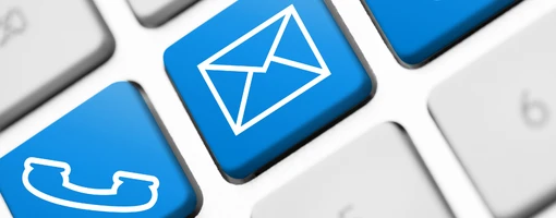 Keyboard keys with icons of a telephone handset and letter envelope