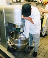 Apron caught in mixer with no guarding