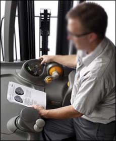 Figure 1. Employee performing pre-operation inspection.