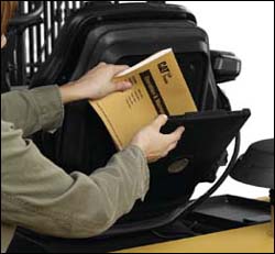 Figure 9. Operator ensuring that the operator manual is on board the forklift and legible.