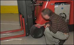 Figure 3. Operator checking condition of tires.