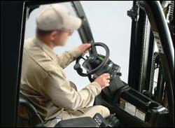 Figure 12. Operator conducting operational inspection with engine running.