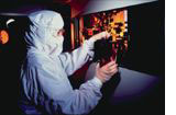 Technician examining a reticle