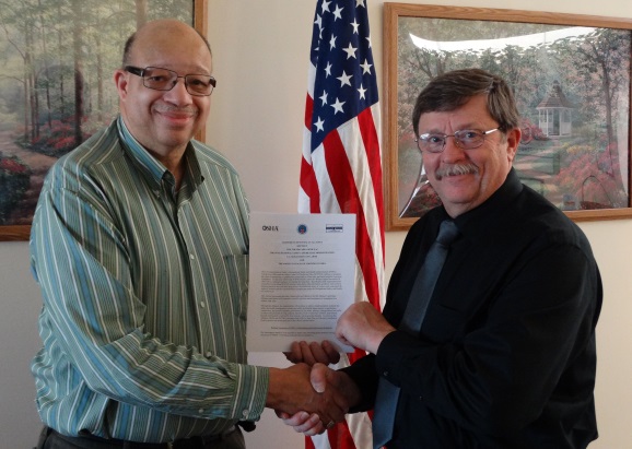 From left; Dennis McMickens, president and CEO of Safety Council of Northwest Ohio and Acting OSHA Area Director, Joseph Margetiak renew an alliance to provide resources to area employers.