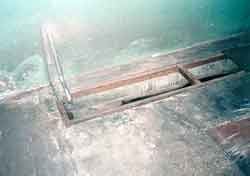 Image of equipment and uncovered holes creating tripping hazard