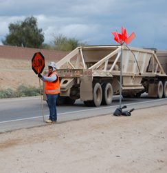 female construction worker with slow sign