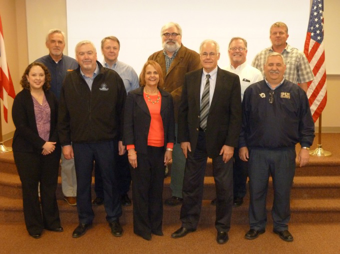 The Columbus OSHA Area Office renewed their partnership with Central Ohio NECA and IBEW locals 683 and 1105 on March 22, 2016 at The Electrical Trades Center in Columbus, Ohio. Back Row Left to Right: Randy Butcher, Atlas Industrial Electric Co,Bob Shonkwiler, The Superior Group, Steve Lipster, Director, The Electrical Trades Center, Brian Dew, Mid-City Electric Co.Dave Fetters, Royal Electric Construction Corp. .Front Row: Melissa Linton, Compliance Assistance Specialist, OSHA, John E. Moore, Business Manager, IBEW LU 683, Deborah Zubaty, Area Director, OSHA, Brian Damant, Chapter Manager, Central Ohio Chapter, NECA, Dennis Nicodemus, President, IBEW LU 683| Photo Credit: OSHA | Copyright: Public Domain