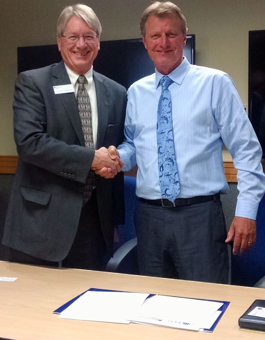 From left: Bruce Baker, president of CVTC and OSHA Area Director Mark Hysell of Eau Claire, renew an alliance to train workers about job hazards