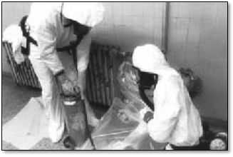Workers safely remove asbestos. First Capital Insulation. Workers safely remove asbestos.