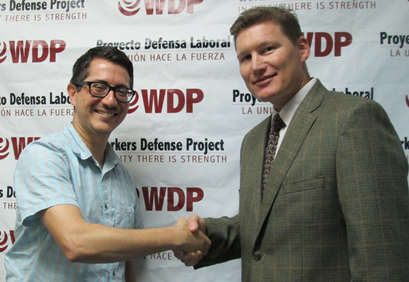 José P. Garza, executive director of the Workers Defense Project, and R. Casey Perkins, OSHA's area director in Austin, sign a two-year alliance renewal agreement at the WDP office in Austin, Texas.