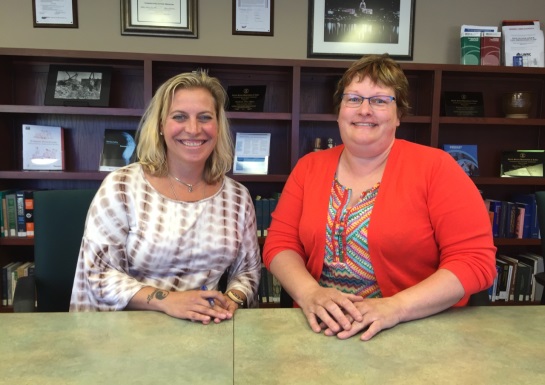 OSHA Area Director Ann Grevenkamp (left) and Wisconsin Veterinary Medical Association Executive Director Kim Brown Pokorny meet to sign an alliance to promote worker safety.