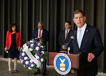 DOL leaders on stage during national Workers Memorial Day ceremony