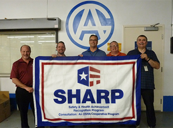 A & A Global Industries holding a SHARP flag