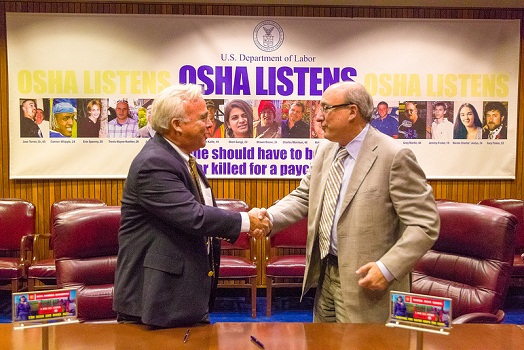 Dr. Michaels (right) and Robert Switzer, Vice President of Operations for Lamar Outdoor Advertising.
