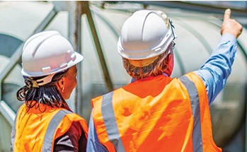 Workers in hardhats and high-viz vests