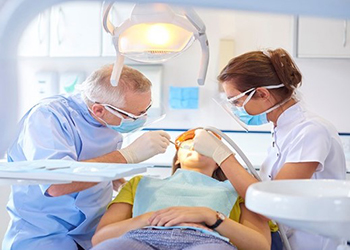 Photo of a dental workers with a patient