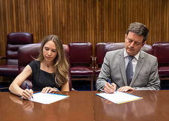 Staff signing alliance documents