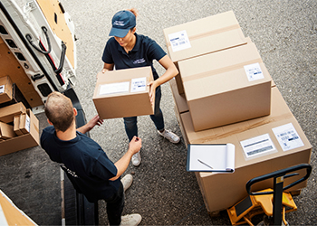 Warehouse workers restocking shelves