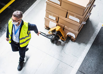 Warehouse worker wearing face mask